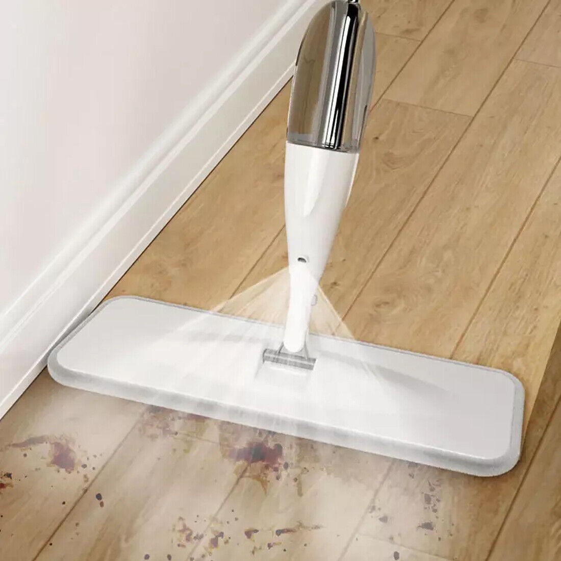 Spray mop with water bottle tank in use”